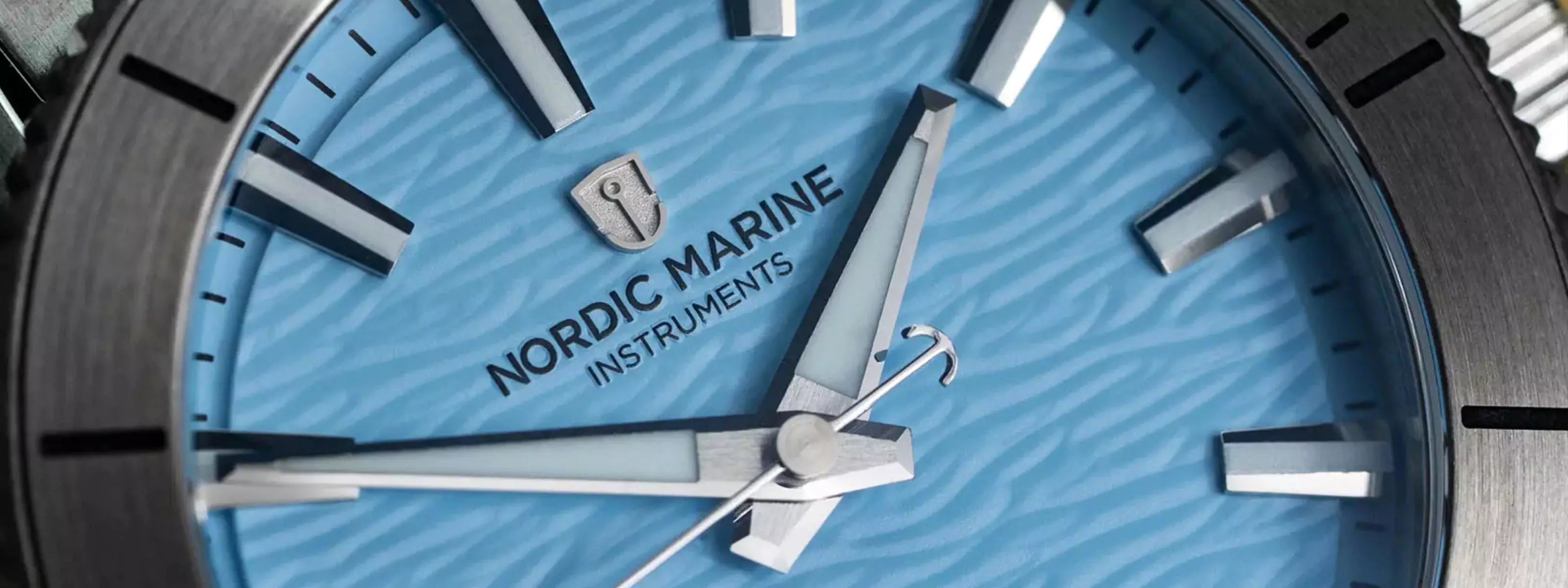 Nordic Marine Instruments watch with blue wave dial and silver accents
